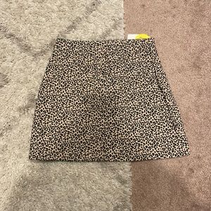 NWT size S Forever 21 cheetah shirt. Never worn. Button detail up the front.